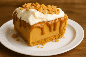 Butterscotch Heaven Pie slice with caramel drizzle and whipped cream