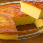Creamy Milk Cake with golden top and soft creamy texture served in a glass dish