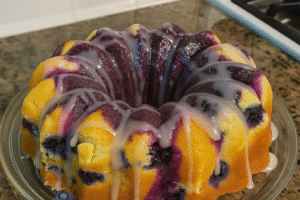 “Classic Blueberry Sour Cream Pound Cake with Glaze Drizzle on Bundt Pan”